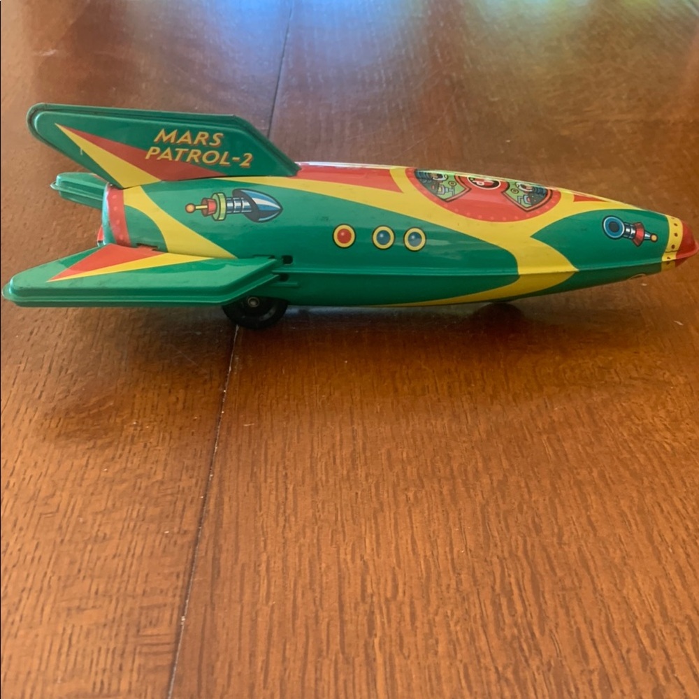 Green and Yellow Retro Toy Car with Swept Back Wings